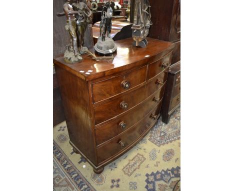 A Victorian mahogany bow front chest of two short over three long graduated cockbeaded drawers, c.1870