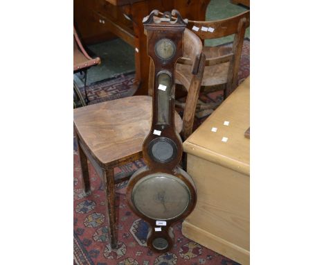 An early Victorian mahogany boxwood inlaid wheel barometer, open swan neck pediment, silvered dials, alcohol thermometer, sig