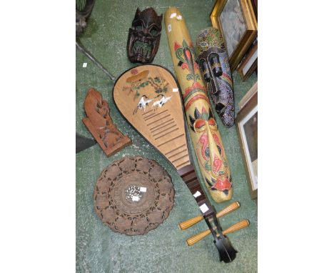 A 20th century Chinese four string Lute, painted front; a wall mask; a totem wall mask; another ; a folding inlaid table (5)