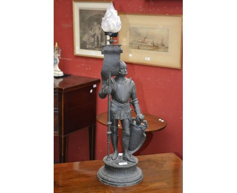 A 19th century French spelter table lamp, Knight in Armour, torch shade