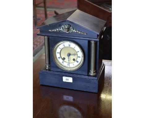 A Victorian Belge noir mantel clock, eight day movement, brasswork decoration.