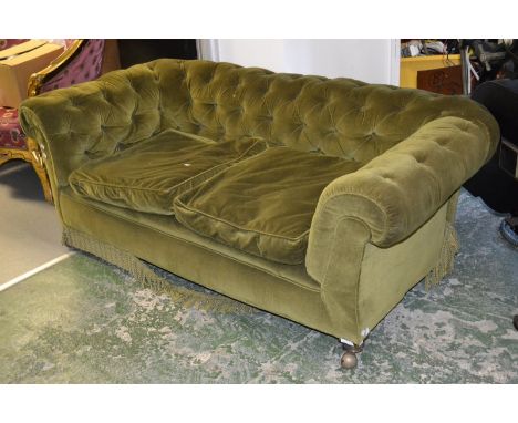 A Victorian drop end Chesterfield sofa, button upholstered.