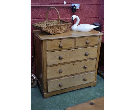 A light oak chest of two over three graduated long drawers, early twentieth century