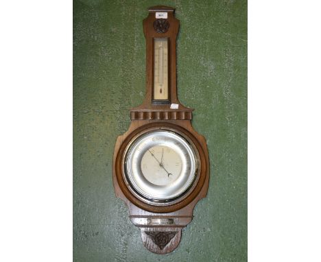 An early 20th century oak Smith's wheel barometer