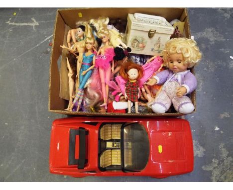 A mixed lot of dolls, predominantly Barbie and similar and a Mattel red Ferrari car