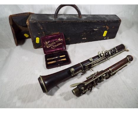 An early period clarinet in black leather case