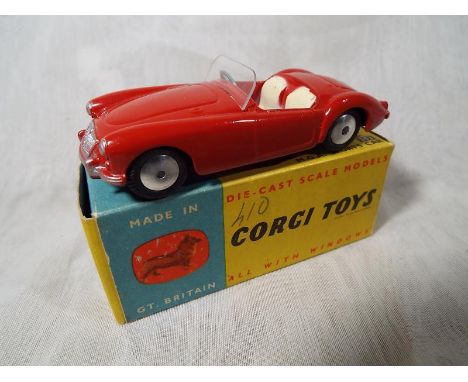 A Corgi die cast model MGA SPORTS CAR # 302 in original box, car near mint, box vg with light wear to one end - Est £50 - £70