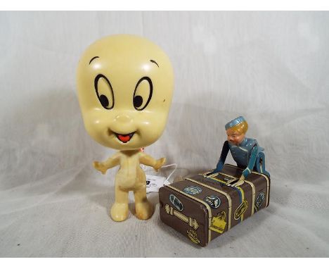 A Mattel 1971 Casper the Friendly Ghost with working talking sound pull cord with a tin plate clockwork bus boy with key mark