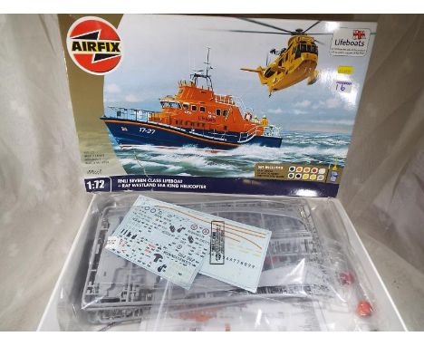 An Airfix RLNI Seven Class Lifeboat and RAF Westland Sea King Helicopter 1/72 scale model mint in good box with instructions.