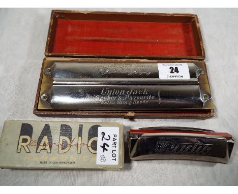 A Double Puck harmonica, marked 'Union Jack' Gerber's Favourite extra strong reeds retailed by W Grime & Sons of Wigan, in ha