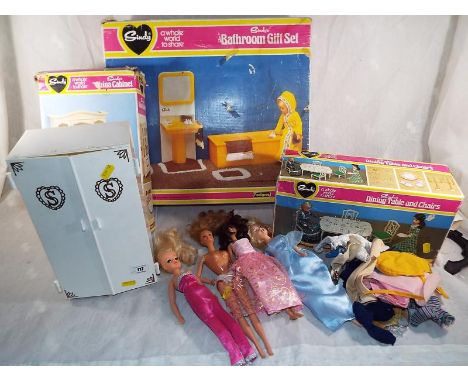 A collection of Sindy by Pedigree accessories to include a dining table and chairs (boxed), a china cabinet (boxed), a bathro