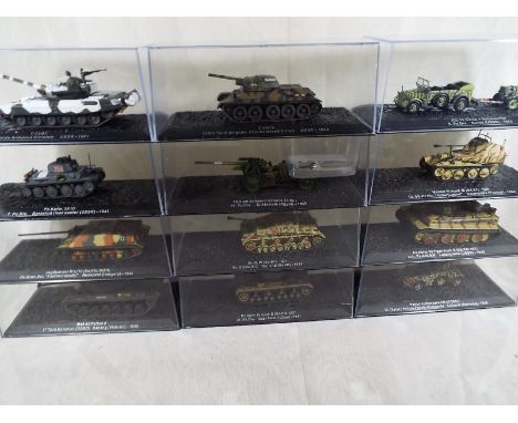 Twelve diecast model tanks and other armored vehicles, mint in transparent cases