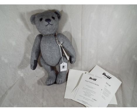 A Steiff Filzteddybar 32 Hellgrau bear with Swarovski crystal necklace, Button in ear, white tag # 035418 issued in a limited