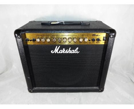 A Marshall MG30DFX 30 watt electric guitar amplifier, with manual - Est £30 - £40