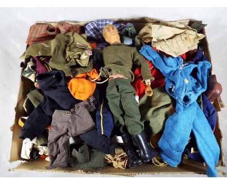 A Palitoy Action Man - An eagled eyed Action man figure with flock hair and a collection of vintage clothing and accessories 