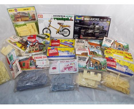 A collection of Airfix model kits to include OO - HO scale signal box, village church, general store, thatched cottage, platf