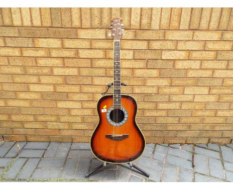 A Tanglewood bowl back acoustic guitar, with EQ-7545R pickup (unfitted but included in lot) with an Ovation fitted hard case 