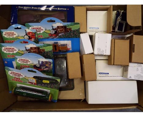 A collection of Ertl diecast Thomas The Tank Engine and Friends model trains, a diecast model motor vehicles to include Ford 