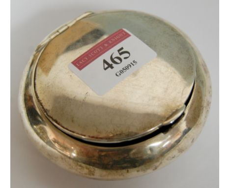 An early 20th century silver pocket snuff box of plain squat circular form with gilt washed interior