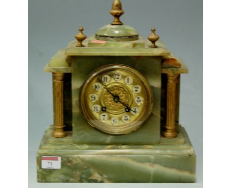 An early 20th century onyx cased mantel clock of architectural form