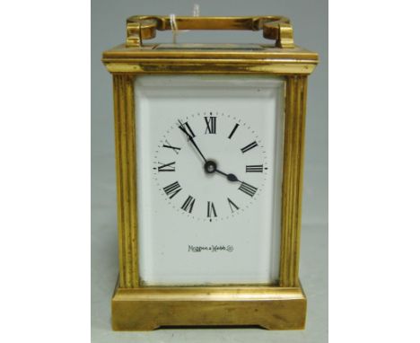 An early 20th century lacquered brass carriage clock, having visible platform escapement, the enamel dial having Roman numera