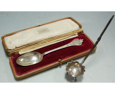 A cased chased silver trifid type spoon retailed by Harrod's, and a small sliver toddy ladle with whalebone handle (2) 