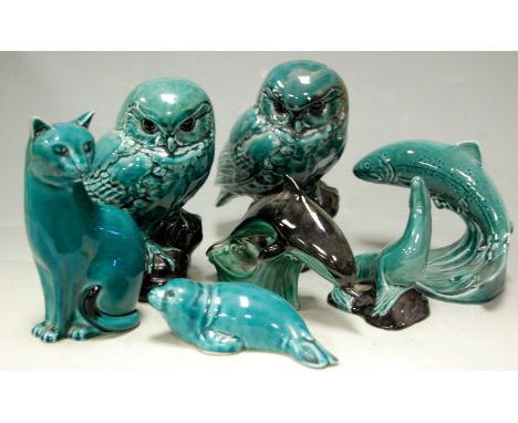 A collection of Poole pottery animal figures to include; two owls, cat, dolphins and fish etc 