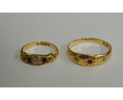 A ladies 18ct gold, ruby and diamond set dress ring, early 20th century; and one other 18ct gold example with smaller stones,