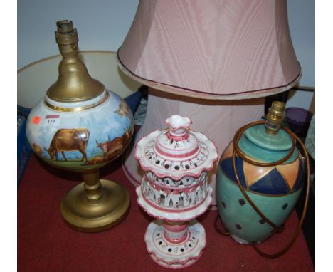 A 20th century continental porcelain table lamp, together with two others and two shades (5)