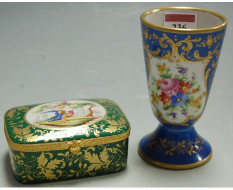 A modern French porcelain conical vase, decorated with a reserve of flowers; and a French porcelain trinket box and cover (2)