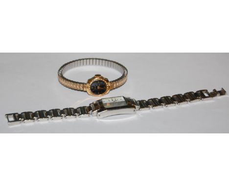 An Oris ladies wristwatch, having manual wind movement and expanding bracelet strap; and a Dunhill steel cased quartz ladies 