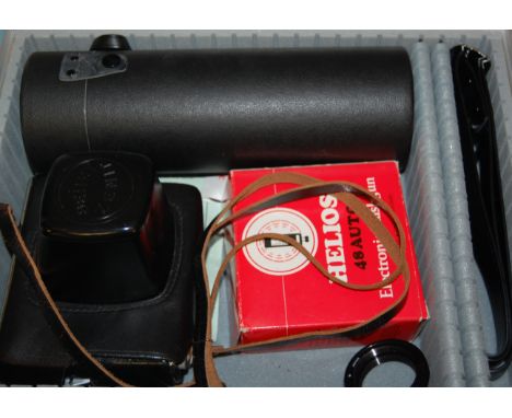 A modern Zenit camera with spare telescopic lens and electronic flash gun, boxed 