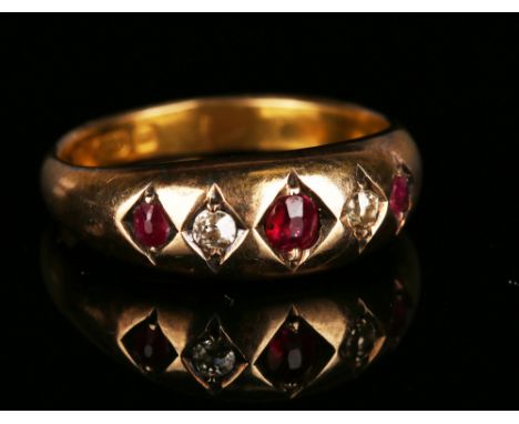 A Victorian 15ct gold, ruby and diamond five stone ring, gypsy set with three cushion shaped rubies alternating with two cush