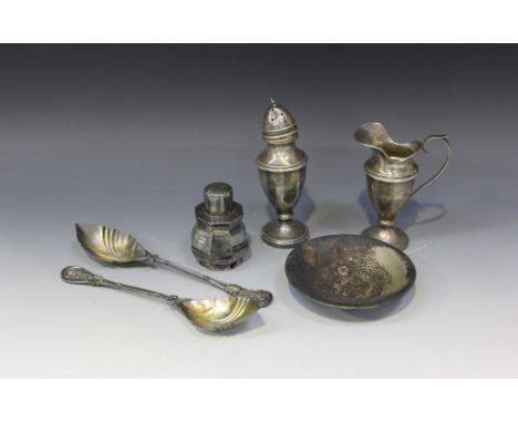 A George VI silver cream jug and sugar caster, each of urn shaped form on a circular foot, Birmingham 1939 by Dennison Watch 