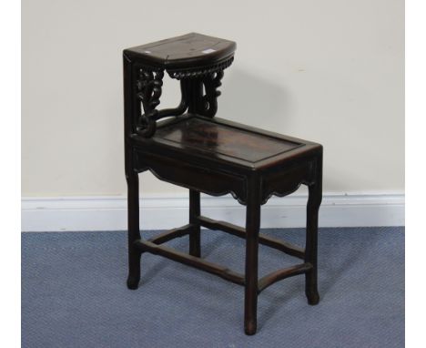 A Chinese hardwood two-tier occasional table, 20th Century, raised on turned legs, united by stretchers, height approx 68cm.