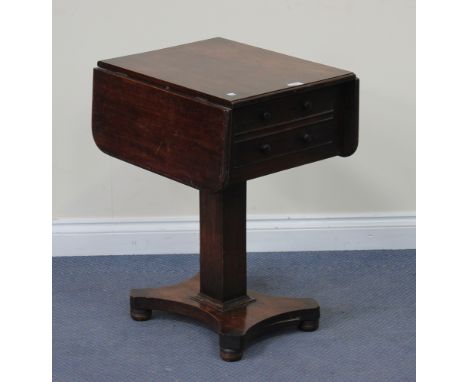 A Victorian mahogany drop-flap work table, fitted with two drawers, raised on a square column, platform base and bun feet, he