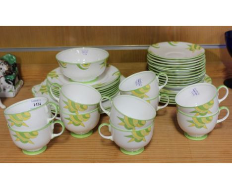 An Aynsley Art Deco bone china part tea service, decorated with green and yellow geometric border motifs, comprising ten cups