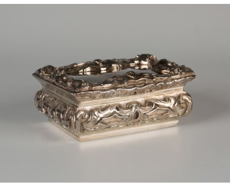 An impressive Victorian silver rectangular table snuffbox, the hinged lid cast in high relief with a border of heavy strapwor