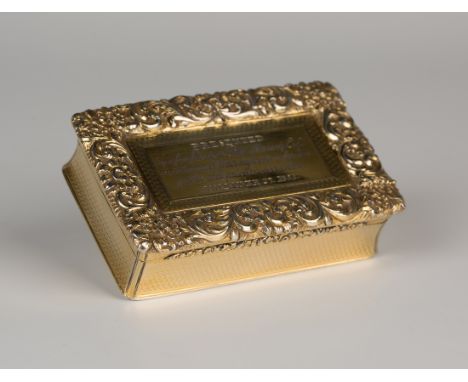 A William IV silver gilt rectangular table snuffbox, the hinged lid finely cast with a border of flowers and foliate scrolls,
