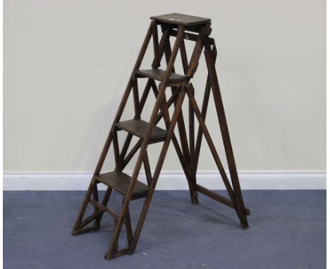 An early 20th Century stained pine 'Remploy' folding step ladder, fitted with four rungs, height approx 107cm.