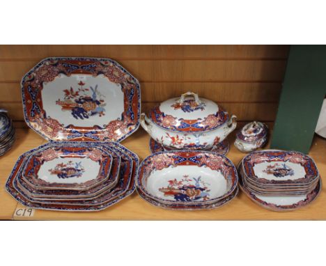 A Spode stone china part dinner service, circa 1820, decorated in the Imari palette with precious objects and flowers within 