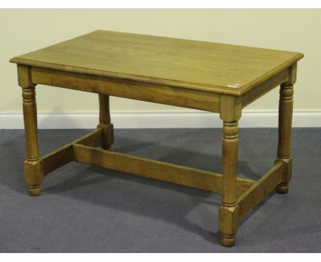 A 20th Century oak rectangular kitchen table, the moulded top on turned and block legs, height approx 71.5cm, length approx 1