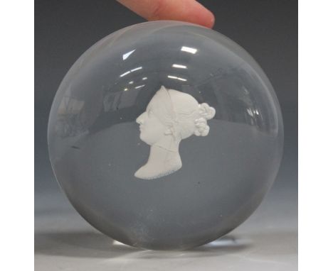 A clear glass sulphide paperweight, mid-19th Century, inset with a sulphide bust portrait of Queen Victoria, inscribed 'Victo