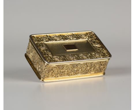 A George III silver gilt rectangular snuffbox, the hinged lid finely cast with a border of fruiting vine, framing an engine t