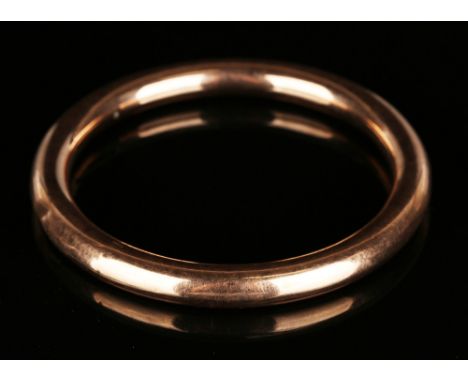 A 9ct gold wax filled circular plain bangle, Birmingham 1918, inside diameter approx 7cm.
