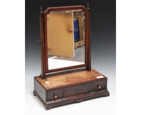 A George IIII mahogany swing frame mirror, the base fitted with three drawers, on bracket feet, width approx 37cm.