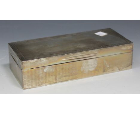 A George V silver rectangular cigarette box with engine turned decoration and presentation inscription, London 1925 by Goldsm