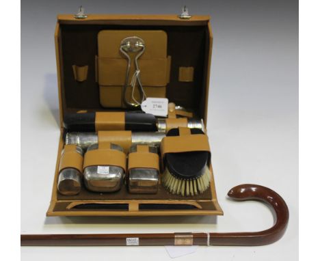 A mid/late 20th Century gentleman's travelling vanity case by Asprey, London, the tan leather case fitted with plated contain