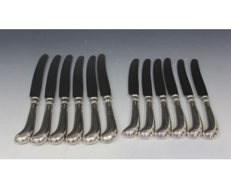 A set of six silver pistol handled table knives and six dessert knives, Sheffield 1968 by William Yates Ltd.