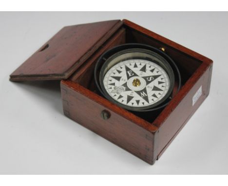 An early 20th Century gimbal mounted compass within a mahogany case, a set of late George III steel balance scales by J. Drap